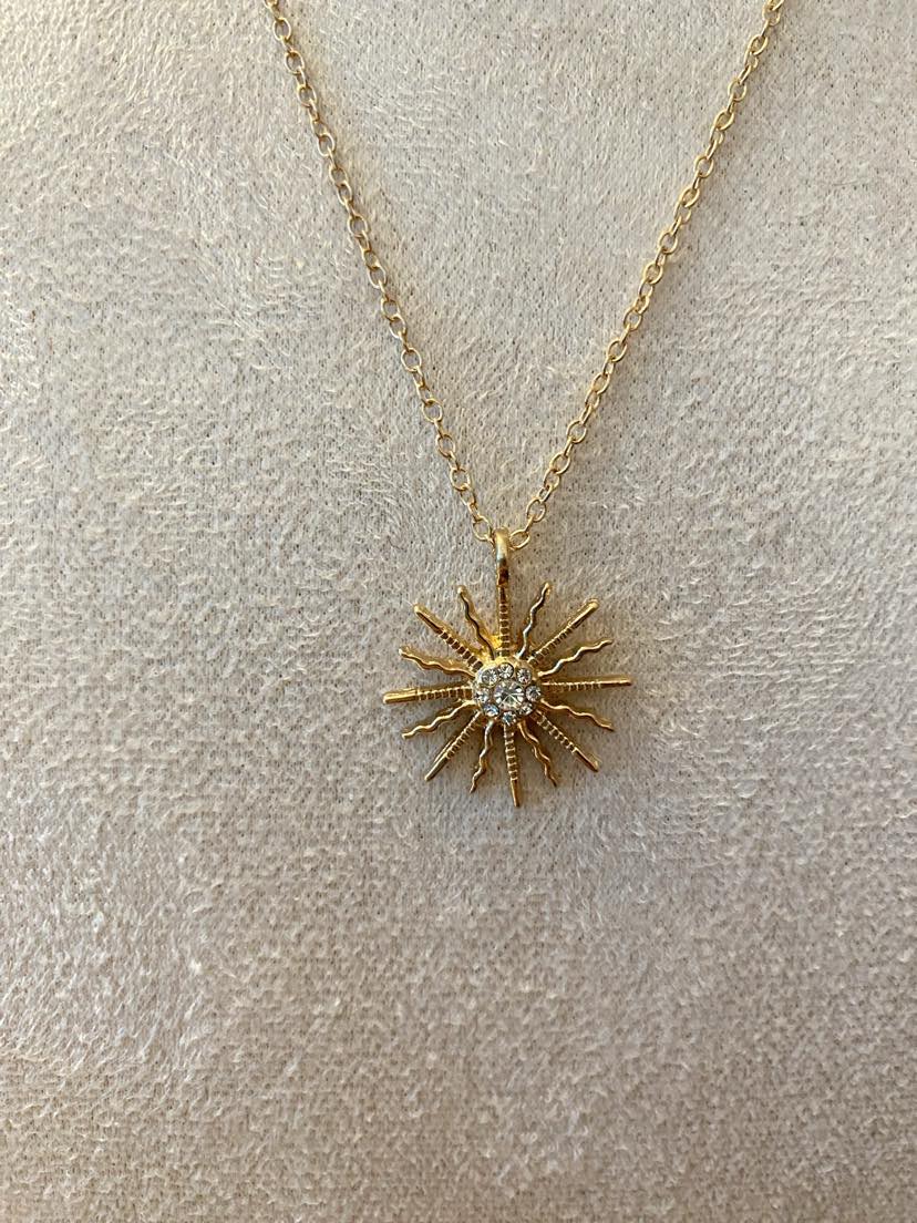 Sparkly Sun Shaped Pendant On A Yellow Gold Coloured Chain