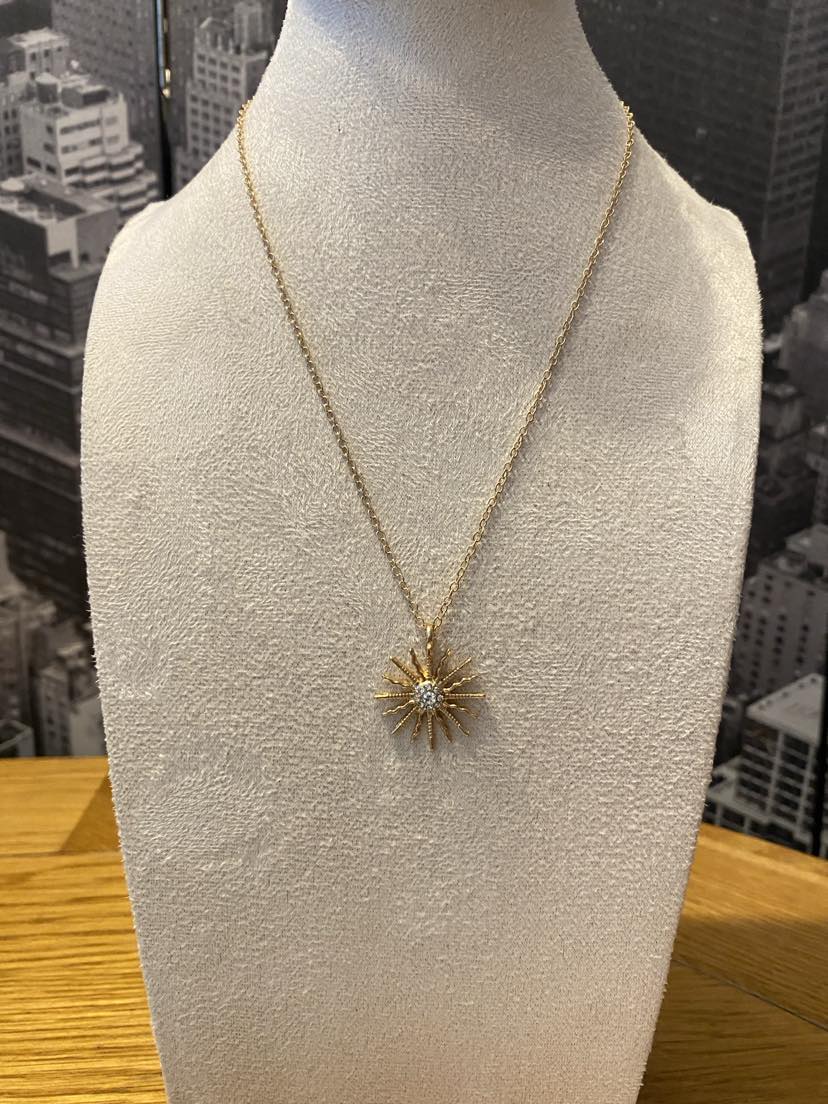 Sparkly Sun Shaped Pendant On A Yellow Gold Coloured Chain