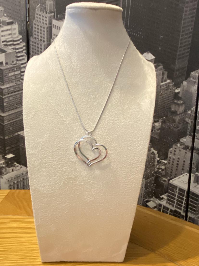 Simply Beautiful Double Heart Pendant on a silver coloured chain