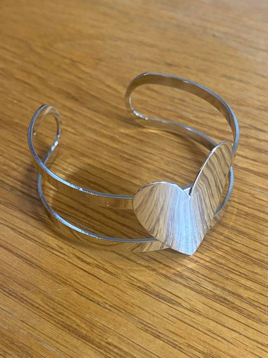 Solid Heart Design Bracelet In A Silver Colour