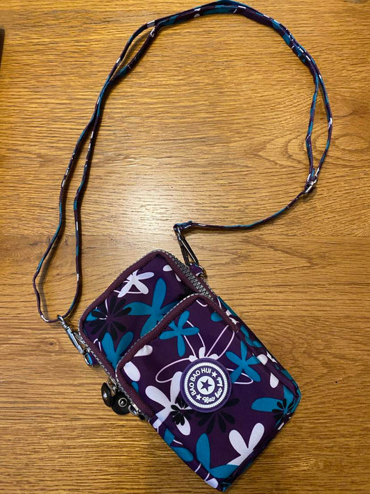 Purple crossbody phone bag with white and green flowers