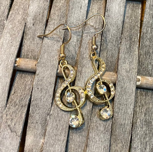 Sparkly Treble Clef Dangly Earrings In A Golden Colour